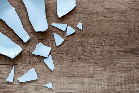 Shards on the background. splinters, Fragments of a tableware on the floor. debris and pieces of a broken Plate,dish. close upの写真素材