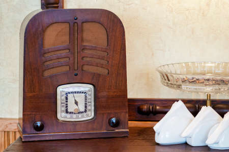 Old wooden wireless. Classic vintage radio receiver. Retro of old receiver. First radio media.の写真素材