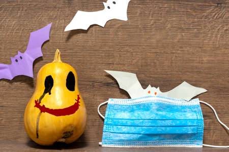 Pumpkin for Halloween. Hallows' Day.protective mask Halloween pumpkin head. QUARANTINE, PANDEMIC,の写真素材