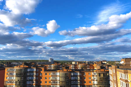 The sky over the city. Clouds over houses