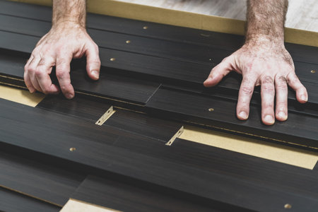 hand. furniture parts. Hands and wooden structures. furniture assembly concept. close-up.