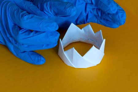 gloves over the crown. The concept of the fight against coronavirus. Concept pandemic, coronavirus, flu.の写真素材