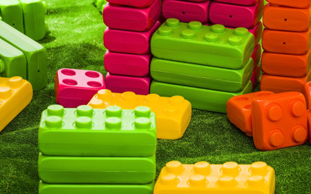 Children's building kit, color toys are scattered on a background. copyspace. A game zone for kids....