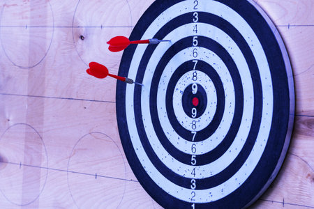 Targets for archery on a background. Three red darts in the target. The concept of three attempts,...