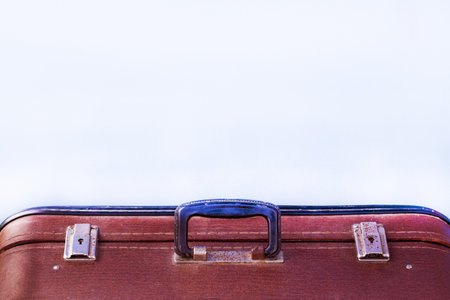 old vintage suitcase.Vintage old classic travel leather suitcase on a light background. Copyspaceの写真素材