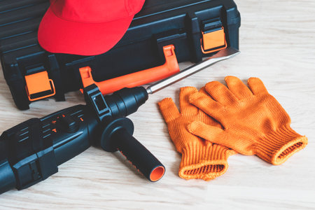 Top view of Working tools. rotary hammer, tool box, work cap, gloves. Worker gear conceptの写真素材