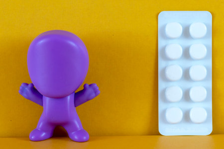 human's figure, pills, medicines on the background. The concept of taking medication, drugs for...