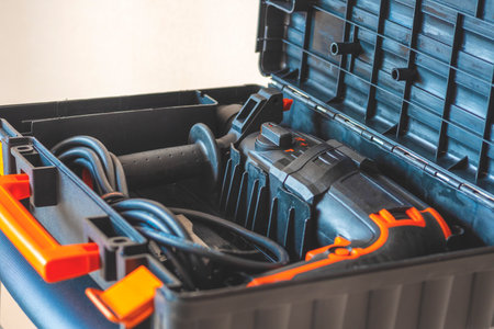 Hammer in a box close up. rotary hammer, rotary drill, perforator in a case for tools close up.の写真素材
