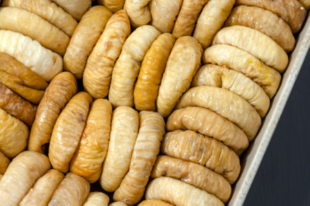 Dried fruit background. Rows of dried dates, apricots, cranberries, blueberries, prunes.の写真素材