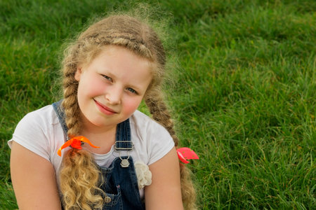 spring girl portrait.,girl on a background of a grass, a woman in springの写真素材