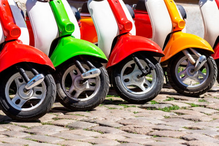vintage scooters parked on sidewalk. Vintage scooters on a city street in retro style. italian style...