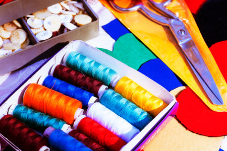Threads, scissors and fabrics. Objects for sewing.close-up Accessories for tailoring.Sewing set.の写真素材