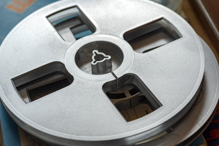 stock, strip. Old Film reel, bobbin, spool against a dark . close up. Bobbin tape recorder. Reel Bobbinの写真素材