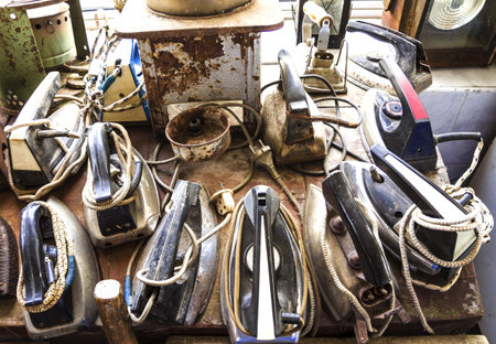 Ancient, vintage irons. It is a lot of first-ever irons. An old subject for ironingの写真素材