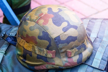 khaki Old Military Helmet. Soldier helmet. Camouflage military protective clothes. A armor - a bulletproof vest. steel helmet. suit with ceramic plates and kevlar. The concept the died military, combatants.の写真素材