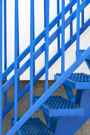 Blue staircase. The concept of a career ladder to clamber up. start date, next stage, career ladder, the beginning of the way. Bright future concept. step up the stairsの写真素材
