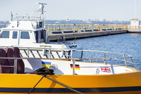 The walking boat with seats. On the mooring the vessel for sea walks in the summer. The concept rest in the ocean. driving by sea boat, ocean, sea ocean, seaの写真素材