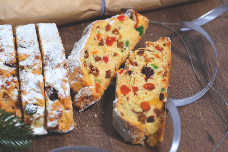 Stollen, pieces of christmas cake. christmas homemade pie.spruce branch. Home baking concept....