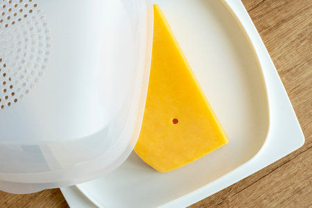 cheese pan.Cheese storage item. Concept of storing cheese in the refrigerator.の写真素材