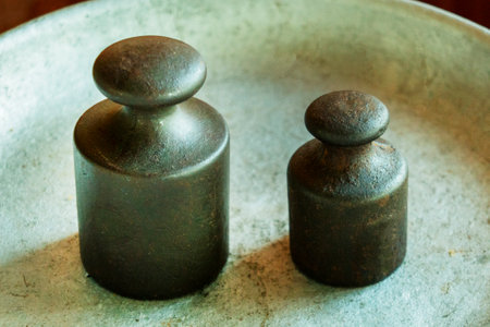 old and rusty weight. Detail of Ancient old scale. weights on scales. close-upの写真素材