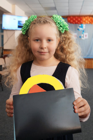 Portrait of a schoolgirl. Concept school days, Back to school. girl in a uniform. pupil, learner,...