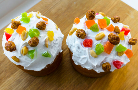 Easter cake, pie. Kulich, pie wrapped in paper. Easter cupcake with white glaze