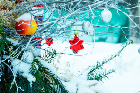 Blurred photo. Beautiful winter background. New Year background with spruce and decorations. Winter Christmas scene.の写真素材