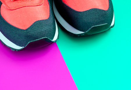 sport shoes on colorful background. New sneakers on background, copy space. terracotta, brown Sneakers lie on a colored surface.close-upの写真素材