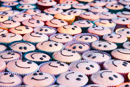 Smiley faces. smile cakes on table. The concept teamwork, friends, society, community, togethernessの写真素材