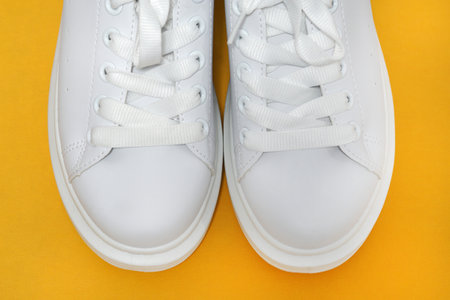 white sneakers, colored background. sport shoes, Lifestyle sneakers sport shoes. Stylish white sneakers. top view .Copy spaceの写真素材