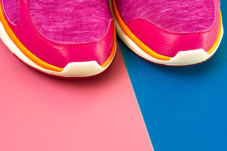 sport shoes on colorful background. New sneakers on background, copy space. terracotta, brown Sneakers lie on a colored surface.close-upの写真素材