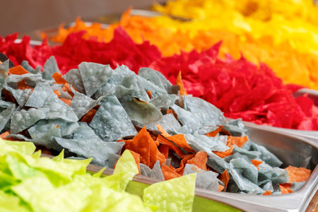 colored chips. Not natural colors of crackers. Not healthy food. close-up Fast food. Multi-colored...