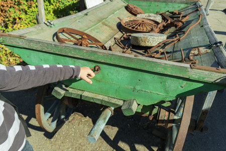 Antiquarian transport. Old wooden two-wheeled cart, vehicleの写真素材