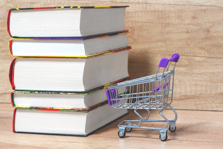stack of books .Trolley. Concept of book trade, book business, knowledge priceの写真素材