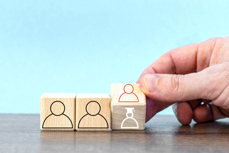 hand keep cube with symbol a person. Appointment of a new manager, team leader. Promotion, career advancement conceptの写真素材