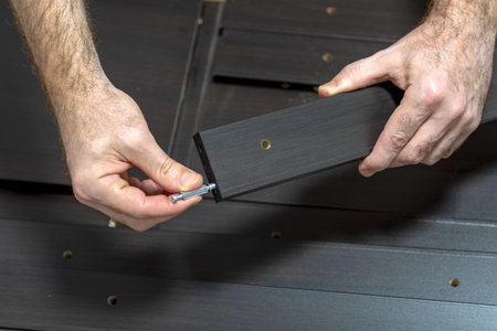 Hand and fittings. Inserting wood joints. Installation of wooden fittings. Furniture assembly...