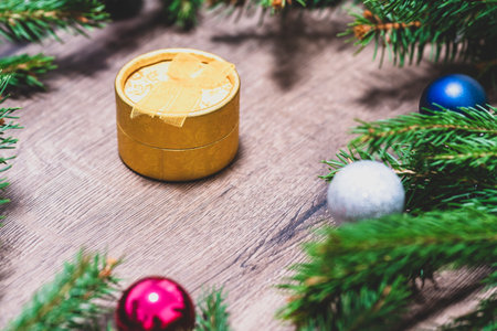 Christmas gift. Christmas box. Spruce branches. Gift, surprise. Close-upの写真素材