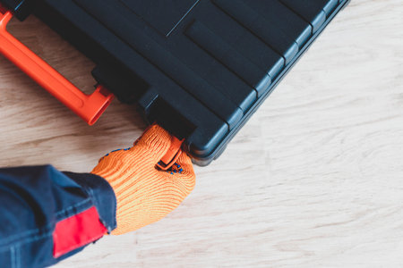person with a case. master with tool box.close up. Worker gear conceptの写真素材