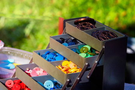 buttons set. bookcase with colored buttons. Objects for sewing. close-up Accessories for tailoring.