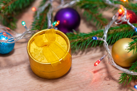 Christmas gift. Christmas box. Spruce branches. Gift, surprise. Close-upの写真素材
