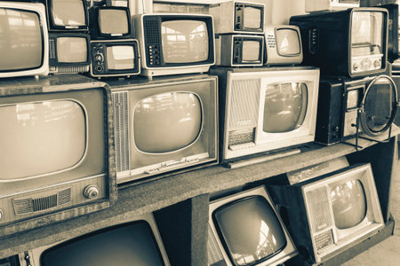 Rows of old TVs.The first televisions are tube-type.Collection Of retro Tv Sets. Black and white photoの写真素材