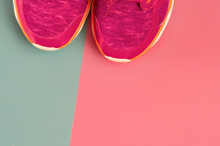 sneakers on background, copy space. Sneakers lie on a colored surface.Pair of sport shoes on colorful background. Top view.close-upの写真素材
