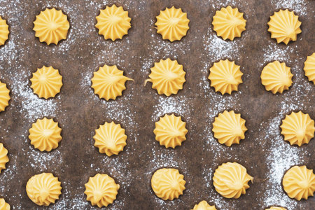 A high-angle shot of raw dough for French pastries, focusing on the symmetry and soft texture of the mounds.の写真素材