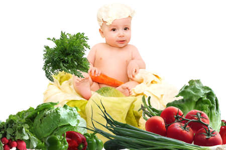 Cute baby chef with big pot and vegetablesの写真素材