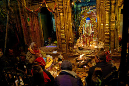 A priest performs night long ritual worshiping the 10th Karma of Seto Machhindranath at Janabahal in Kathmandu, Nepal のeditorial素材