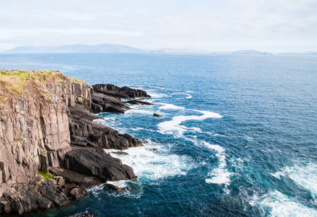 Peacefull ocean and one of many cliffs in Ireland during a spring dayの写真素材