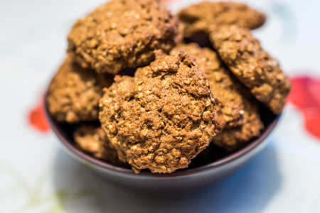 Healthy home made banana sweetened oat cookies served in the bowl. Close up with shallow DOF.の写真素材