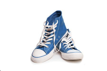 Pair of new blue sneakers isolated on white background.の写真素材