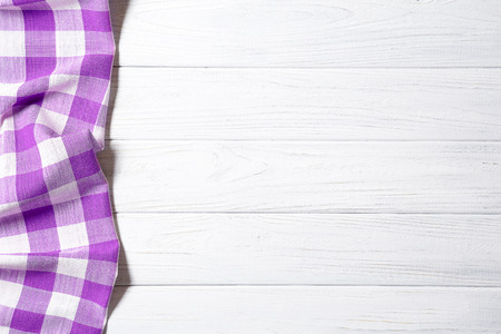 purple napkin on the old wooden table.の写真素材