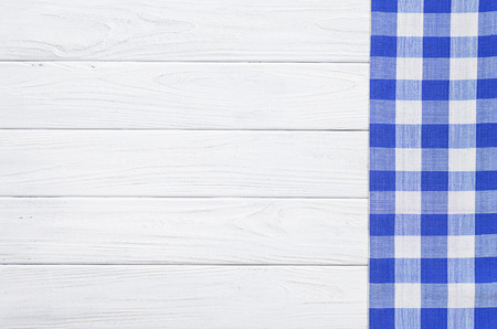 Blue napkin on the old wooden table.の写真素材